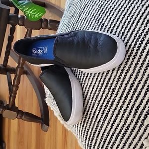 Keds black leather slip ons